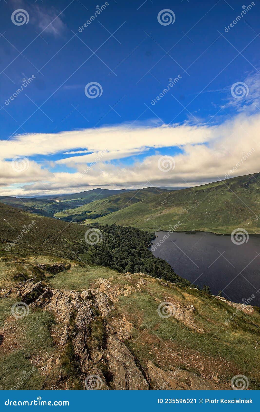 guiness lake, glendalough, wicklow mountain, ireland, sunny dramatic sky,