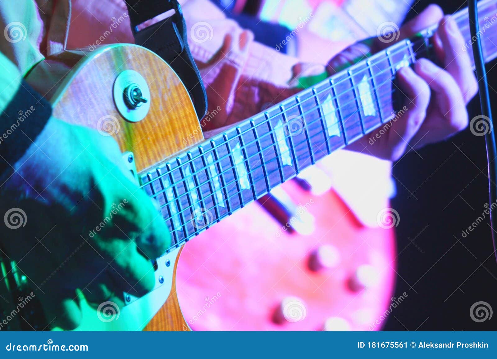 Hands Of Guitarist With An Electric Guitar Pick. Abstract Music