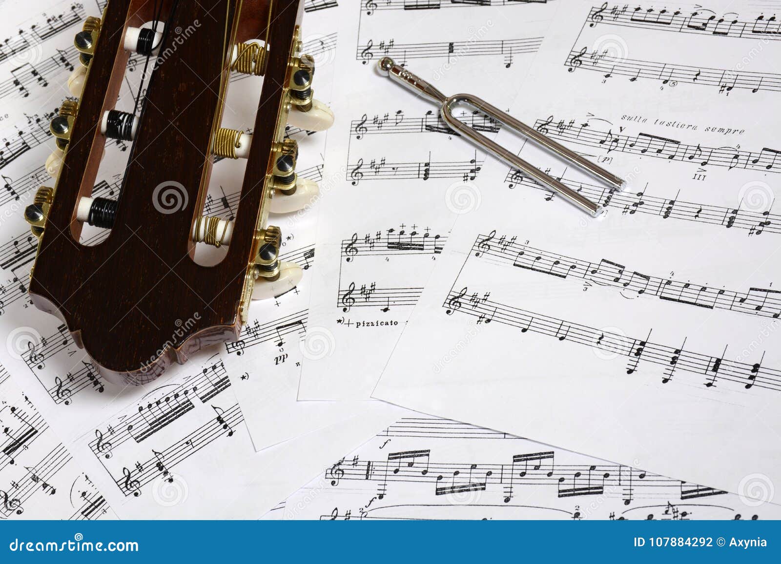 Guitar Head and Tuning Fork Closeup on Notes Stock Photo Image of