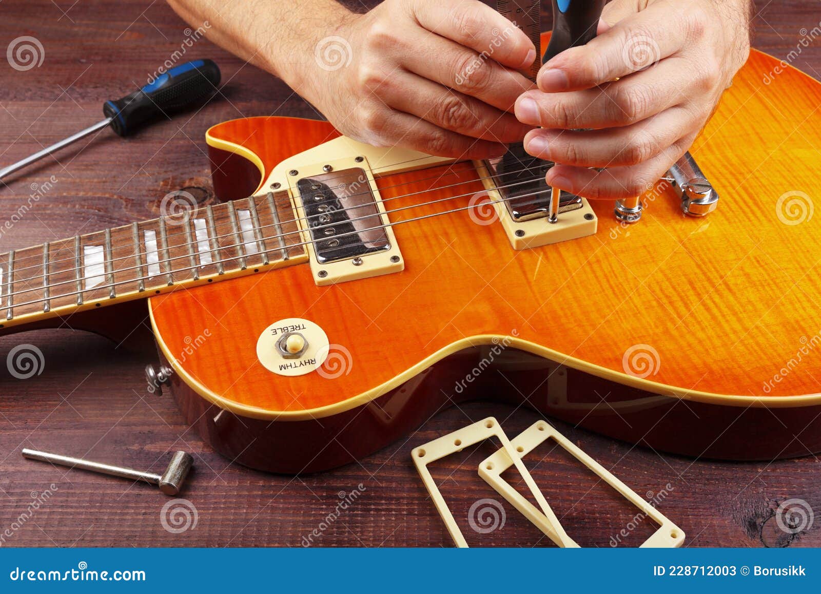 Guitar Master Adjusts Height Pickups on Electric Guitar at His