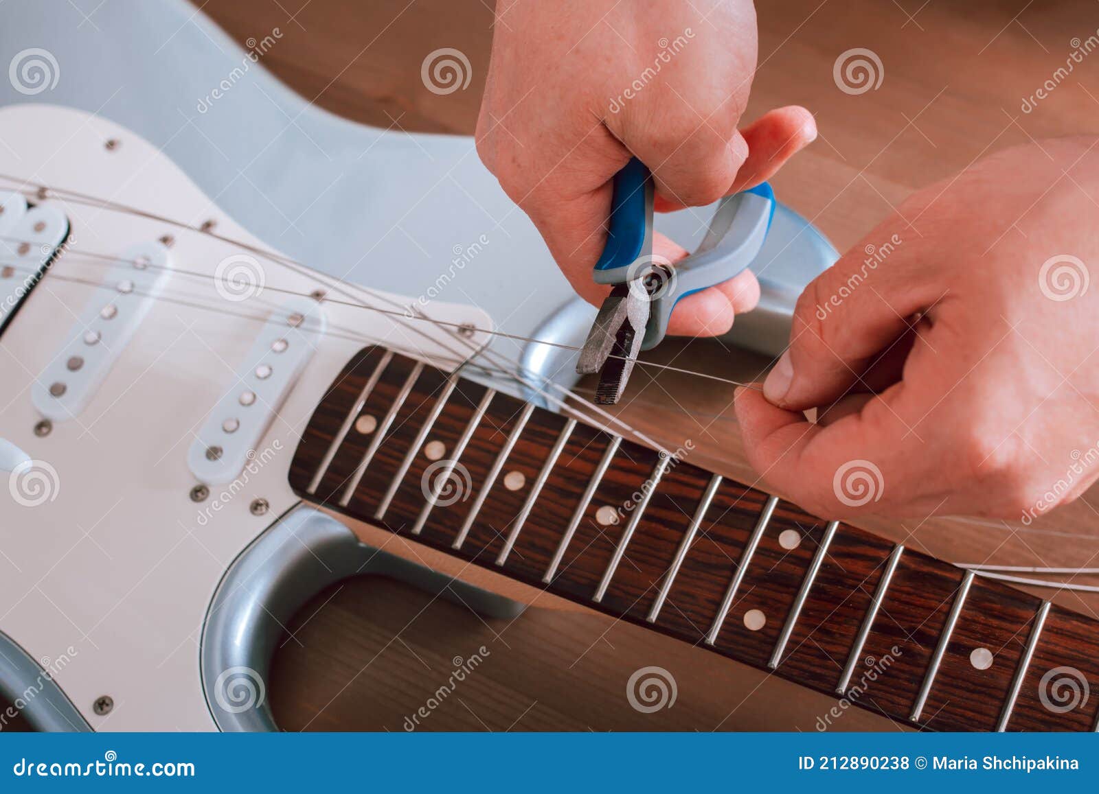 Guitar Master Polishing Headstock Of Electric Guitar, Cleaning Tuners
