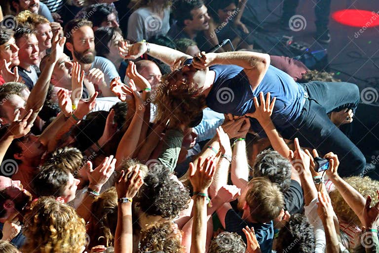 The Guitar Player of Ty Segall (band) Performs Above the Spectators ...