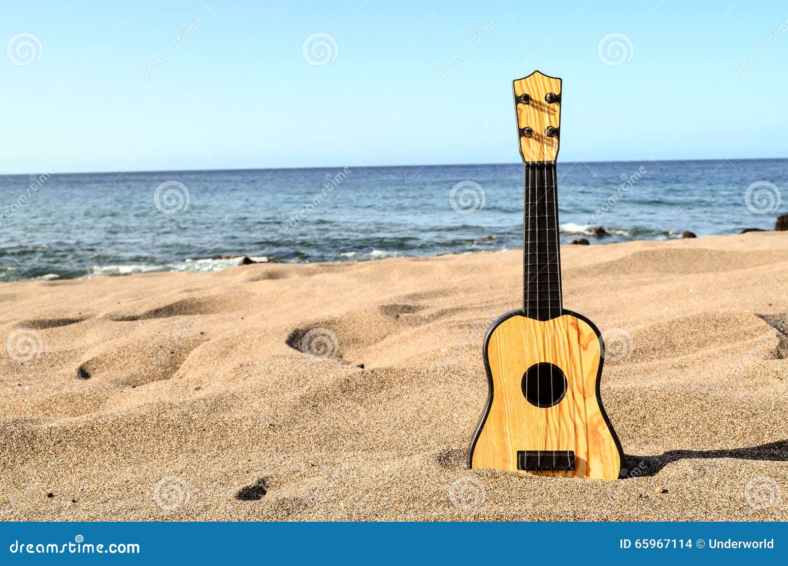 Guitar on the Sand Beach stock photo. Image of rare, resort 65967114