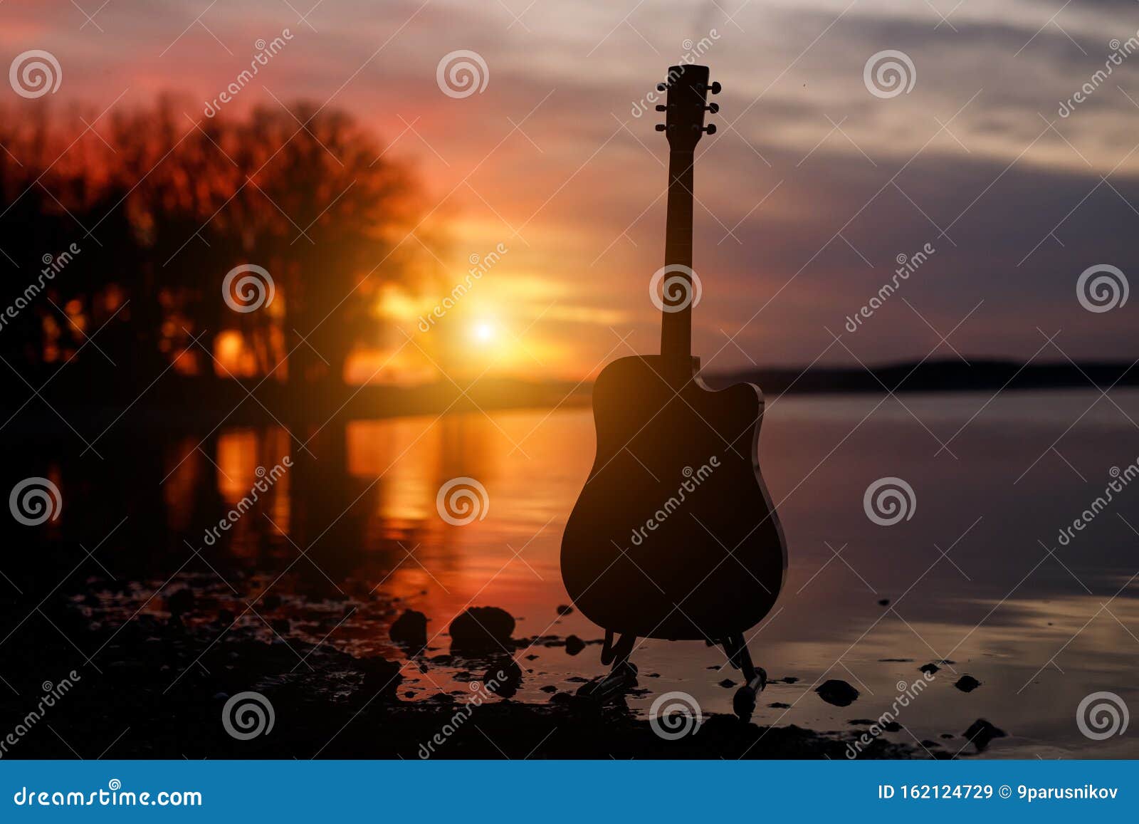 Download Guitar Silhouette At Sunset. Sea And Trees On Background ...