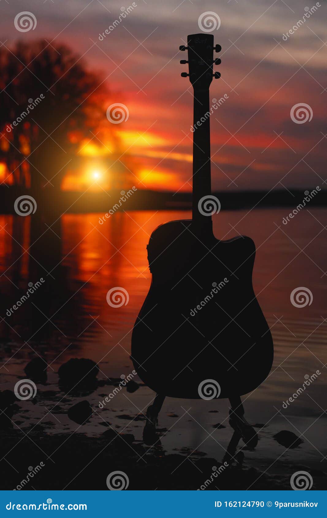 Download Guitar Silhouette At Sunset. Sea And Trees On Background ...