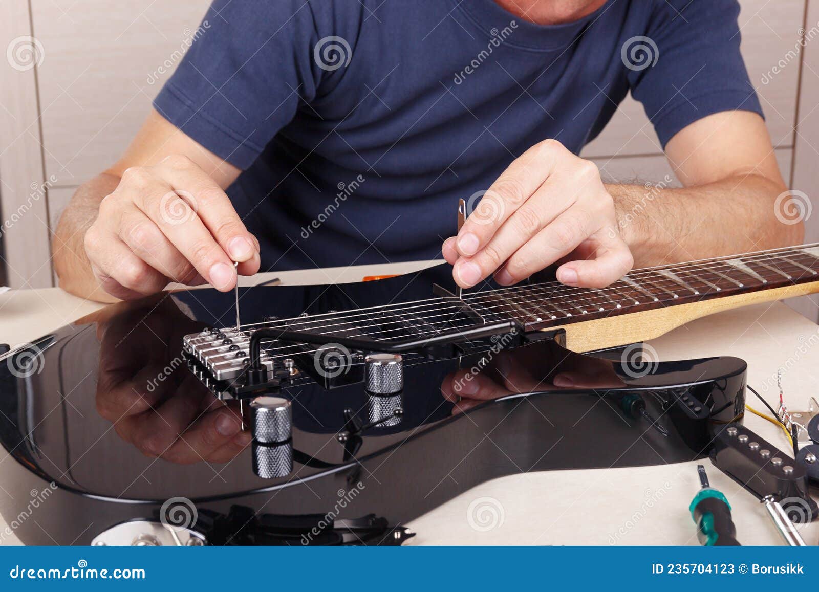 Guitar Technician Adjusts Tremolo Bridge on Modern Electric Guitar Stock Image Image of