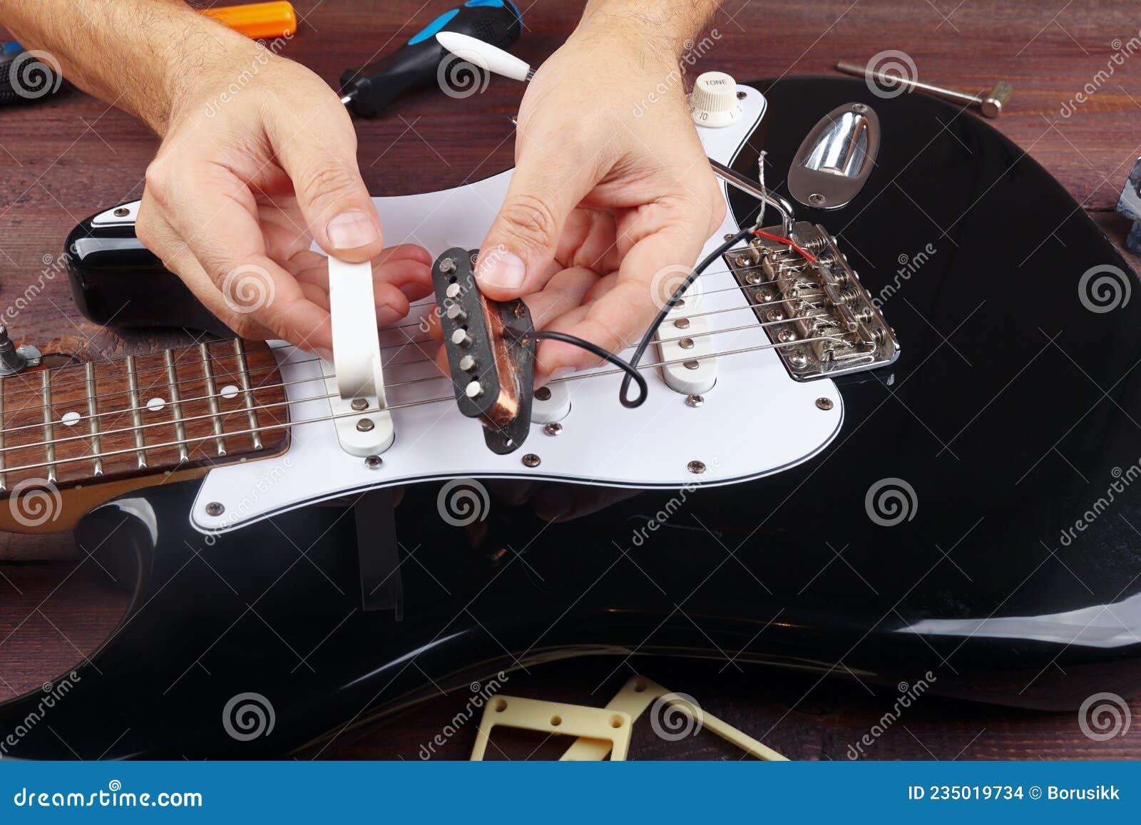 Guitar Technician Selects Pickup for Replacement on Electric Guitar Stock Photo Image of hand