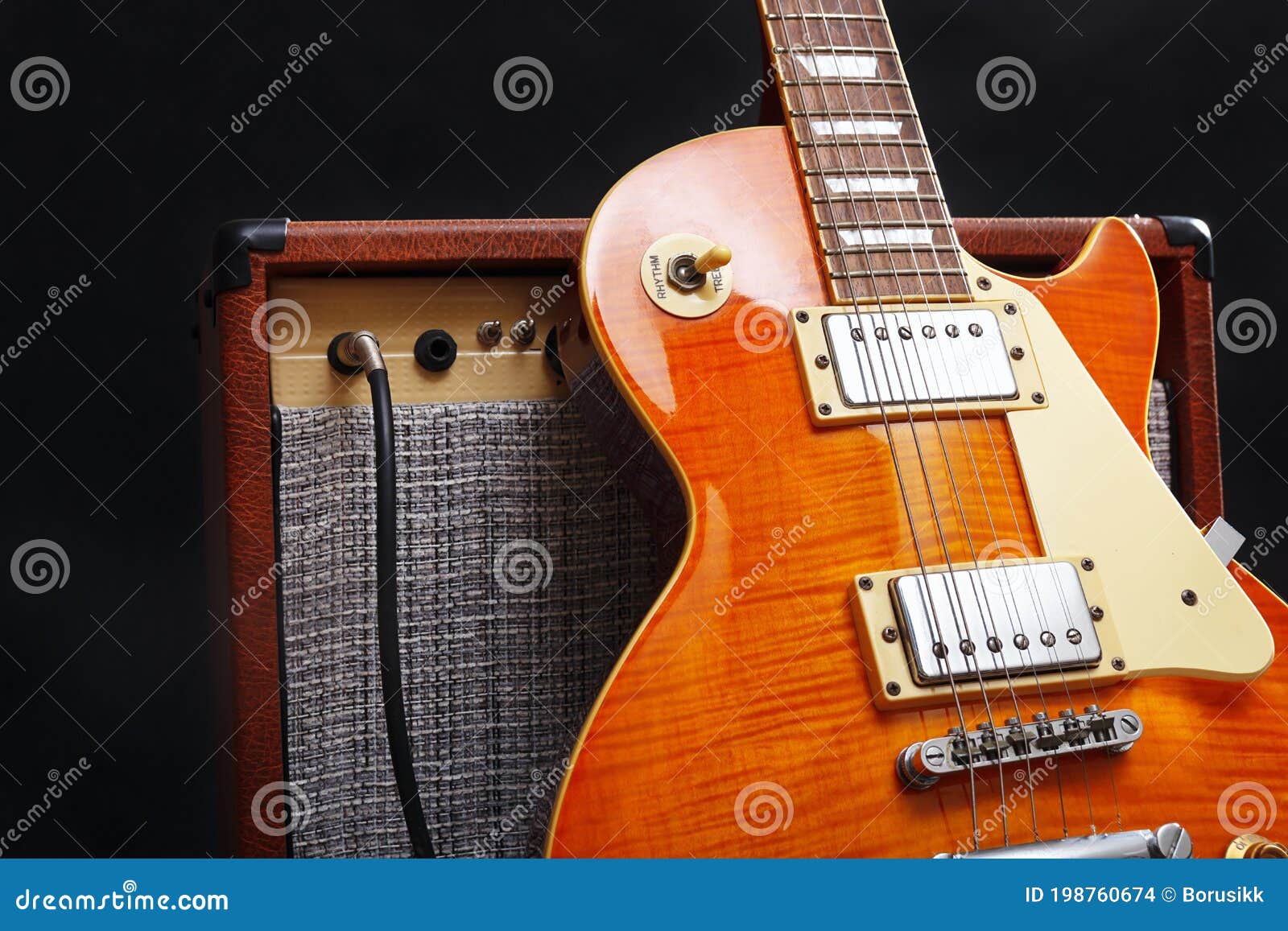 Guitar Tube Combo Amplifier With Honey Sunburst Guitar On Black