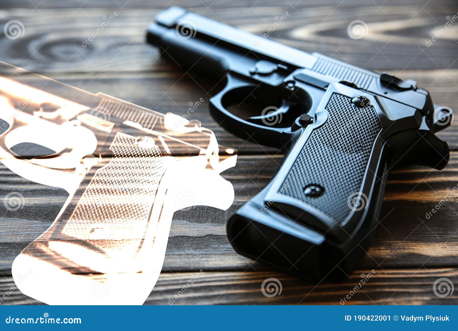 gun lying on wooden background. legalization of weapon