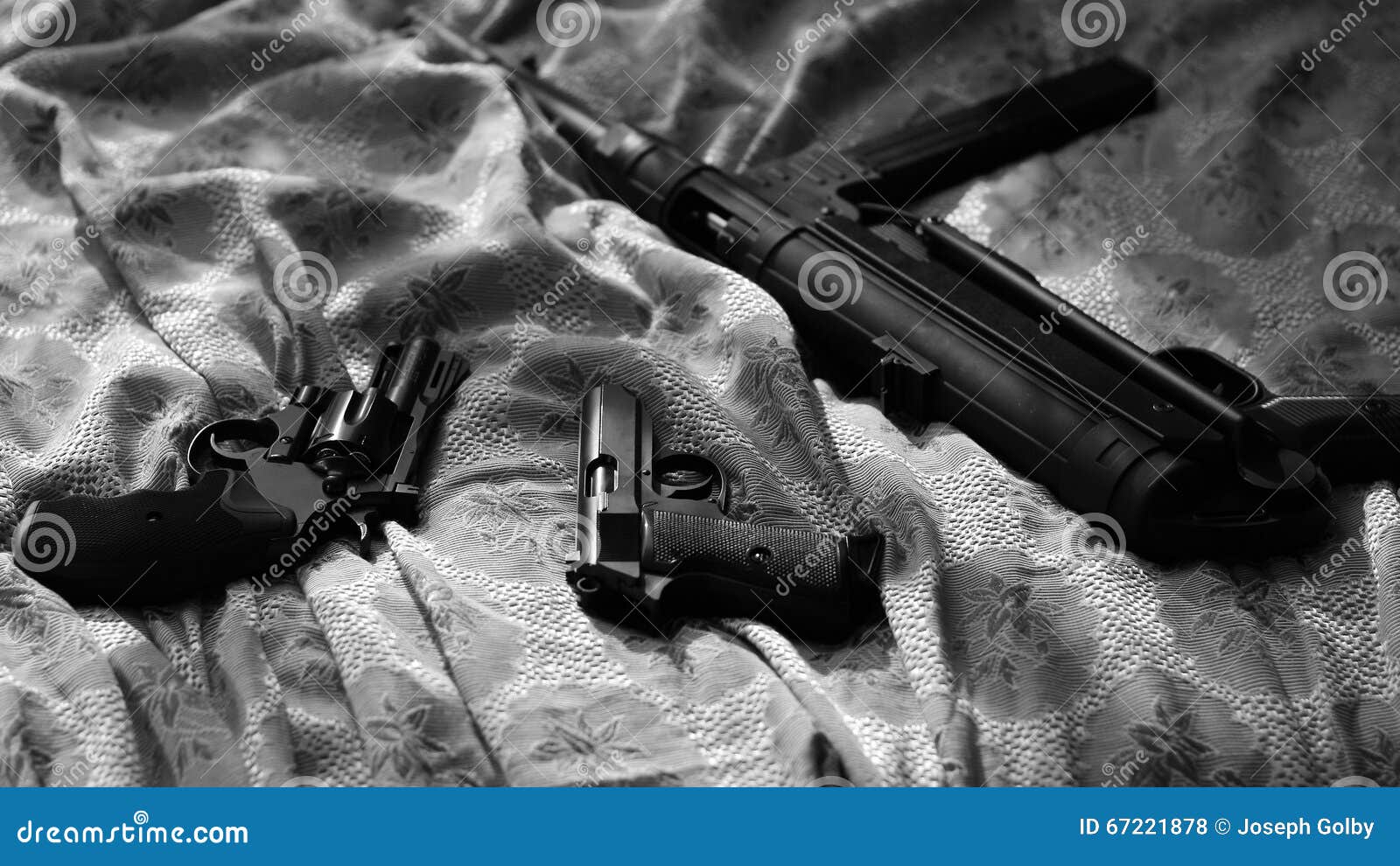 guns on bed sheet. film noir style. revolver, pistol, machine gun.