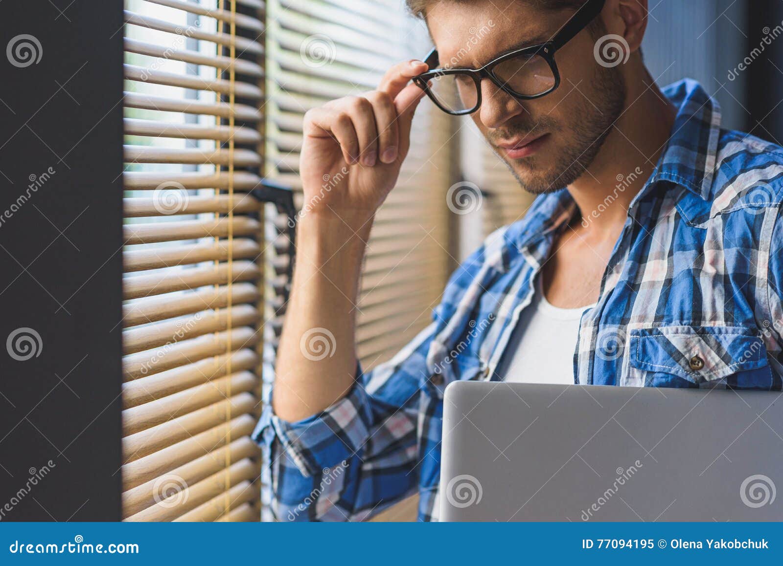 It Guy adjusts his glasses stock image. Image of concentration 77094195