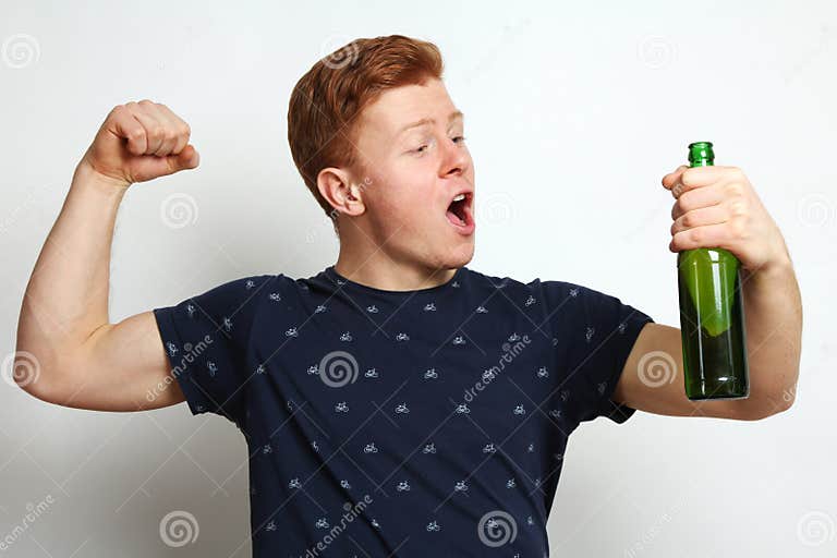 The Guy with Beer Shows Bicepses Stock Photo Image of strong, young