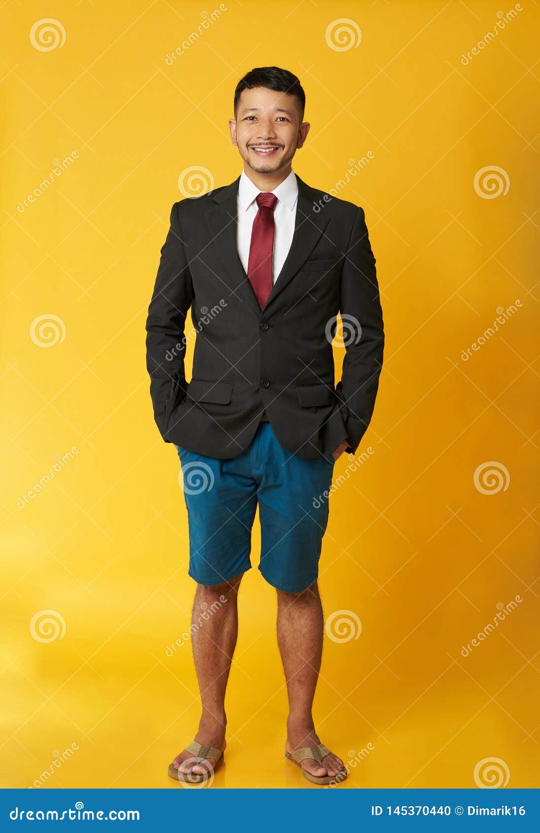 guy with coat and beach shorts