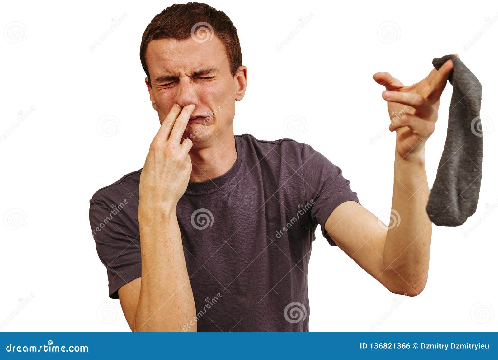 The Guy with Dirty Socks in His Hands on a White Background. Stock