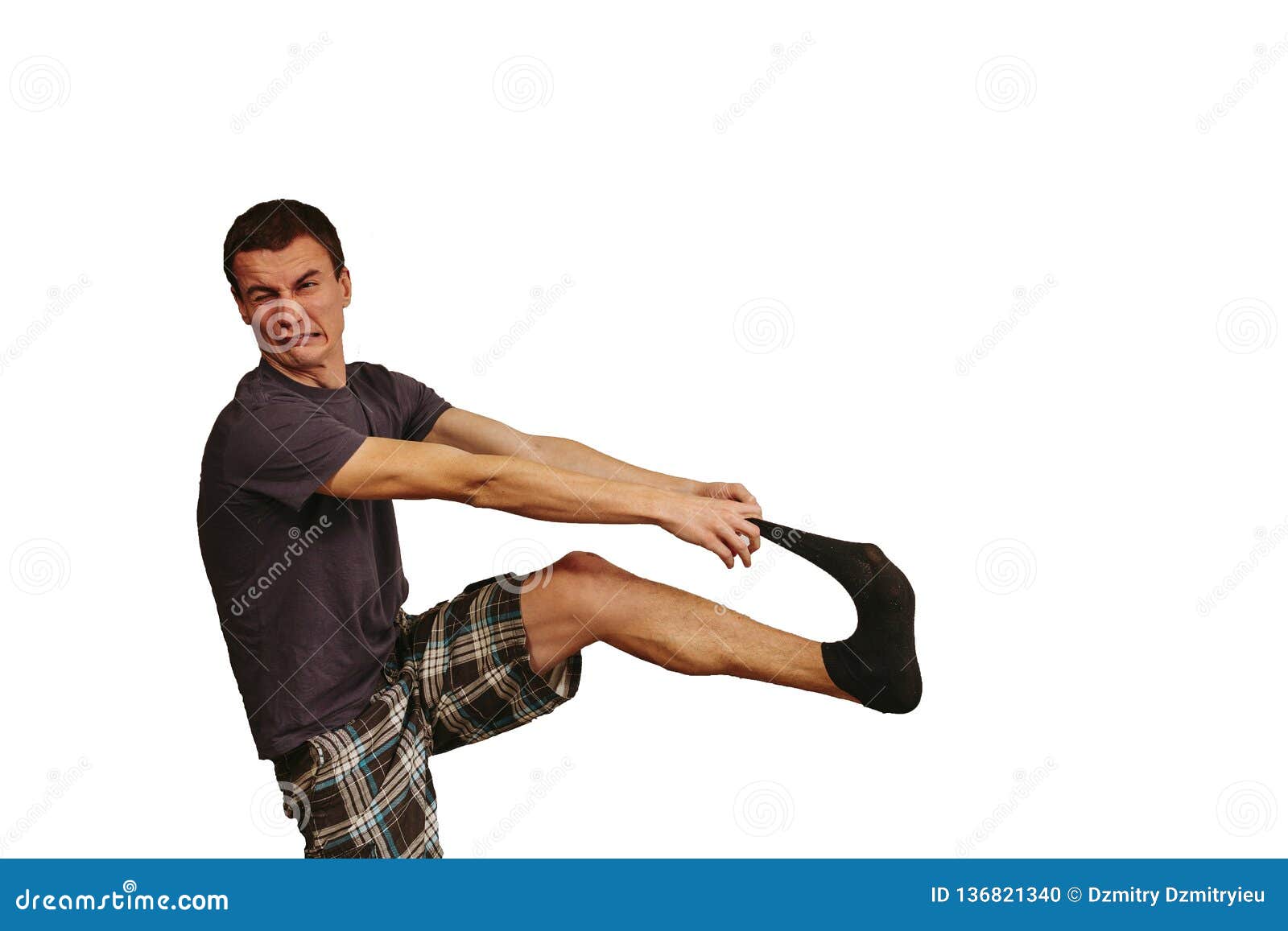 The Guy with Dirty Socks in His Hands on a White Background. Stock