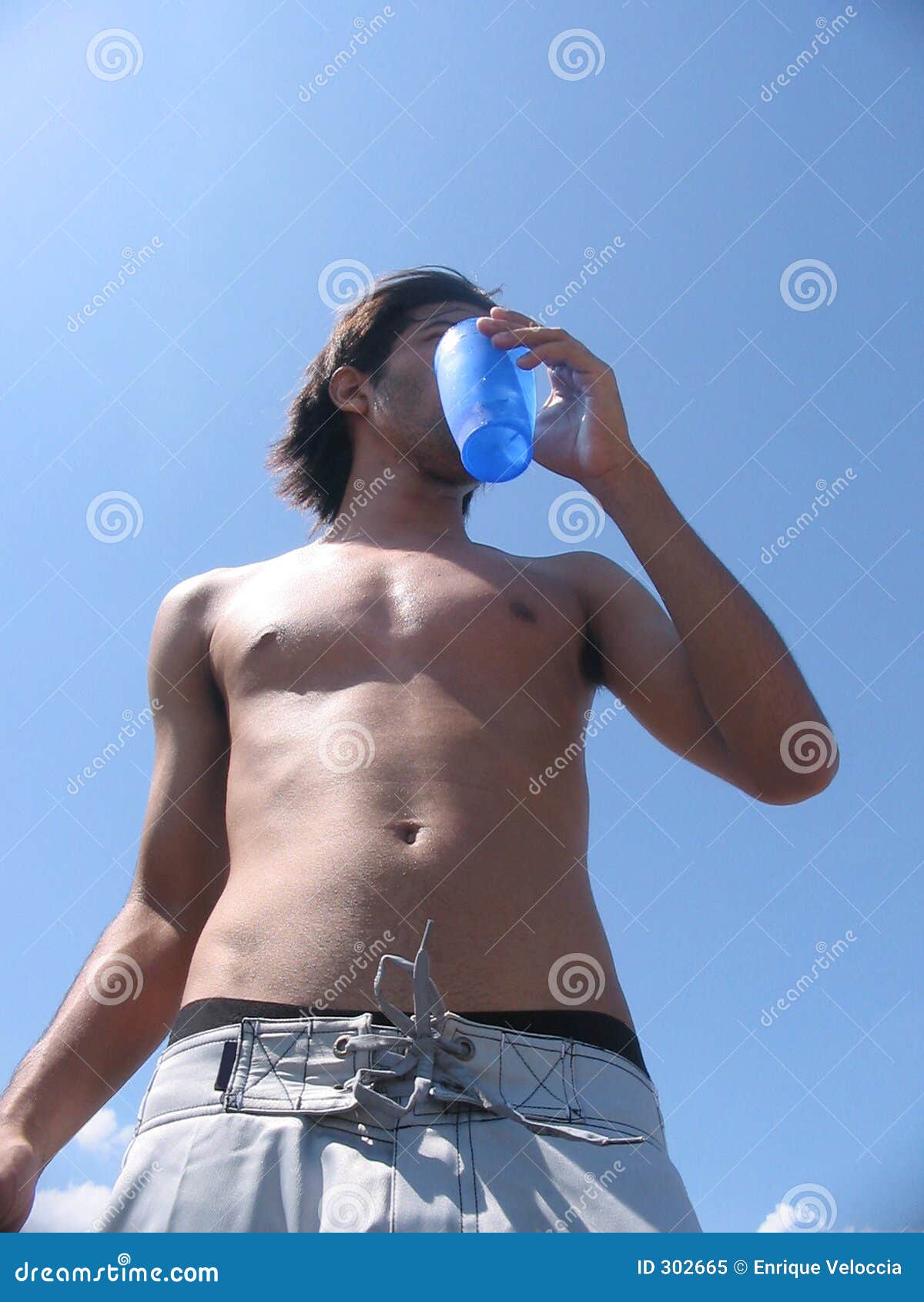 guy drinking at the beach