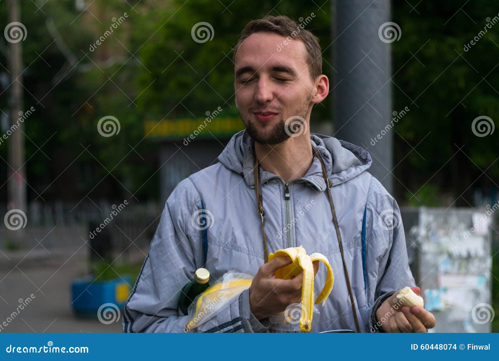 Guy eating banana stock photo. Image of smiling, outdoors 60448074