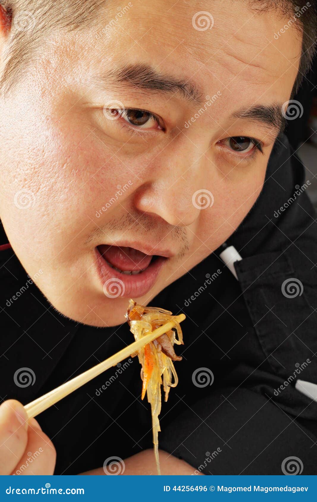 Guy eating glass noodles stock photo. Image of person 44256496