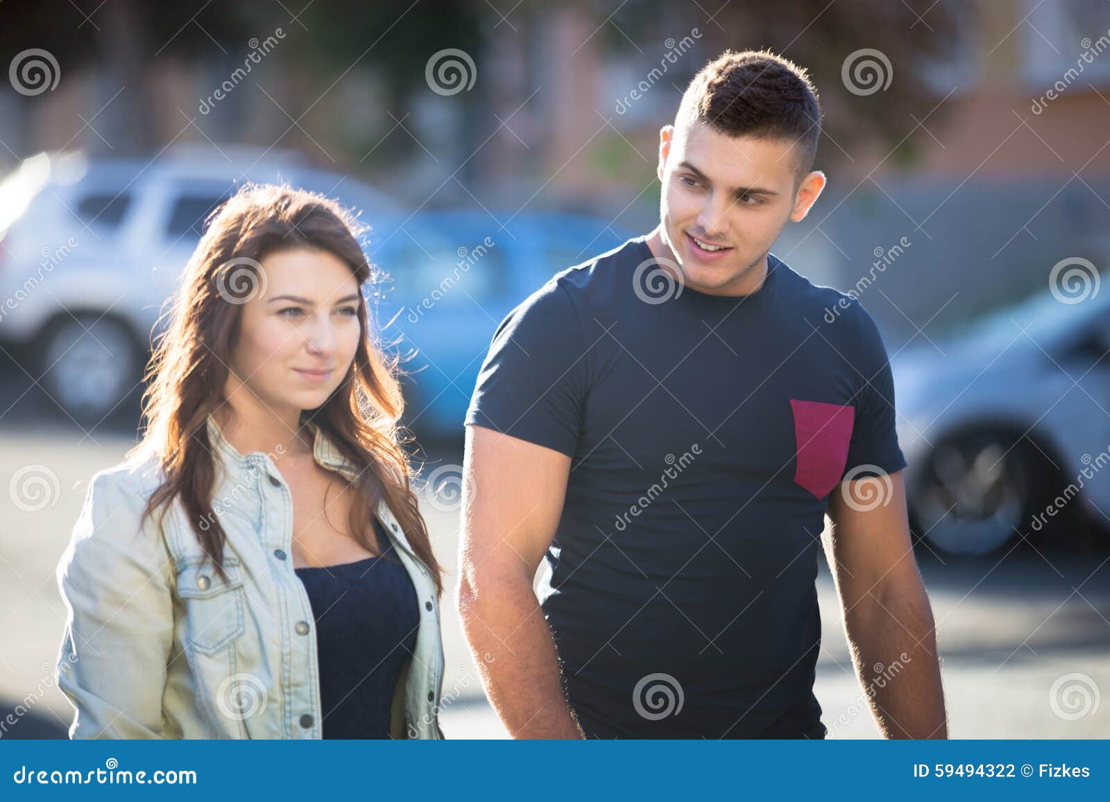 guy flirting with young woman on the street