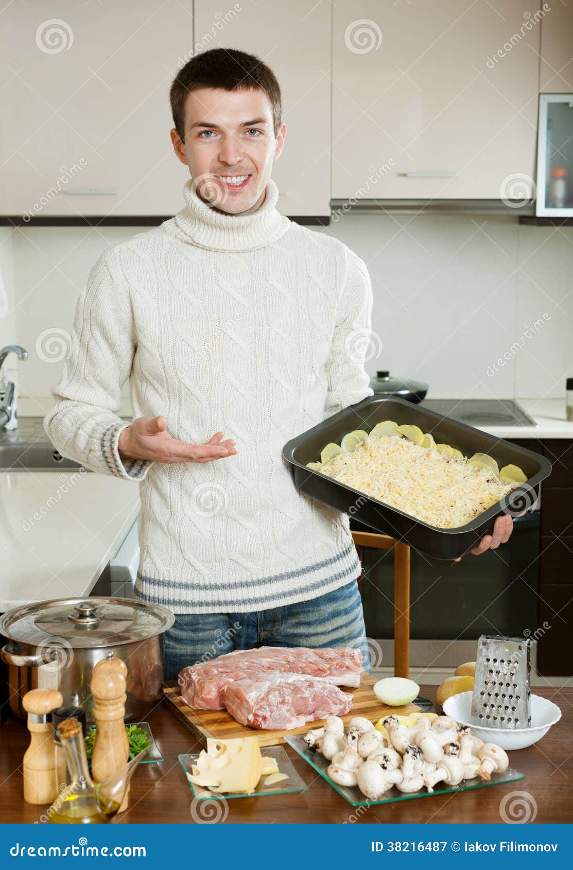Guy with Frenchstyle Meat in Kitchen Stock Image Image of cheese