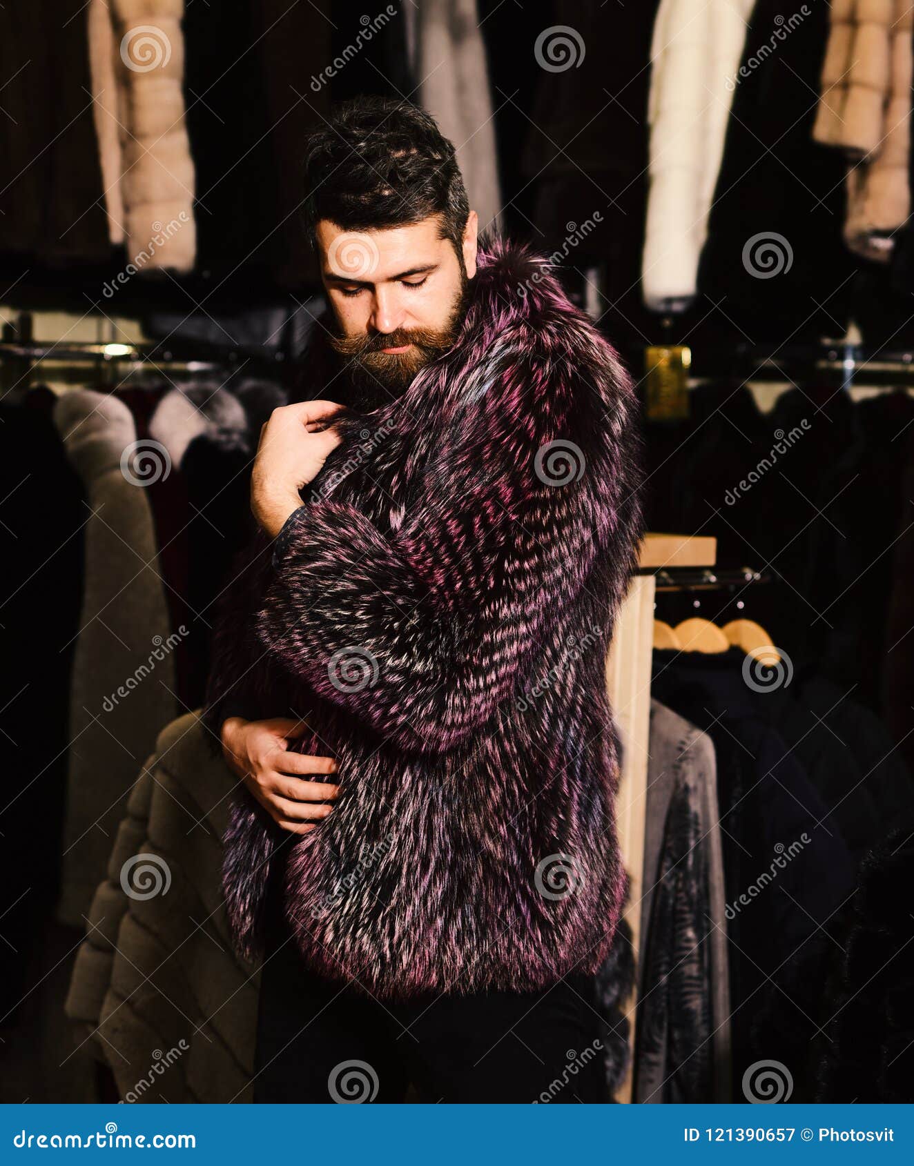 Guy in Furry Coat in Shop with Fur on Background. Stock Image - Image ...