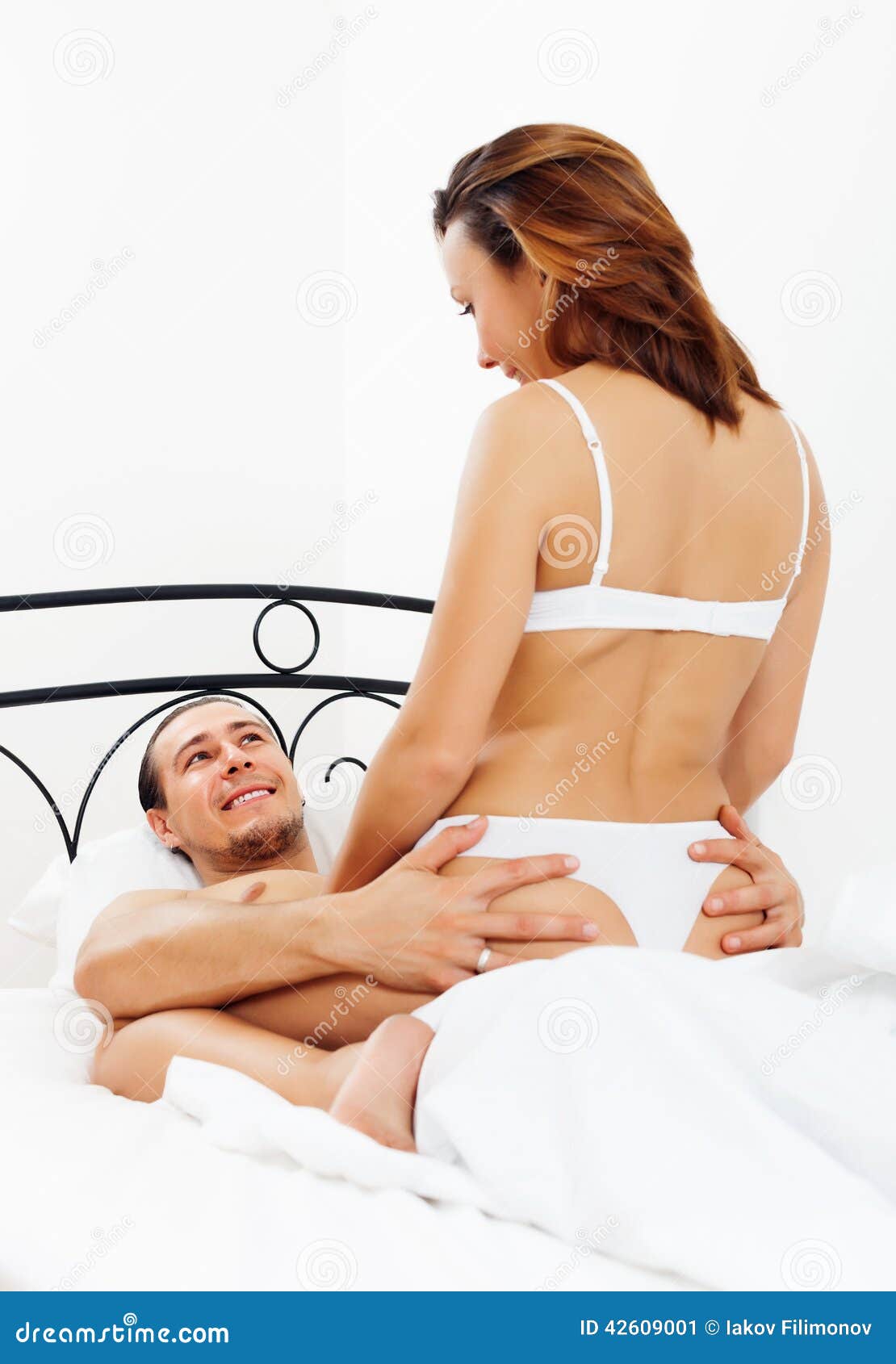 Guy Having Sex with Girl in Bed Stock Image