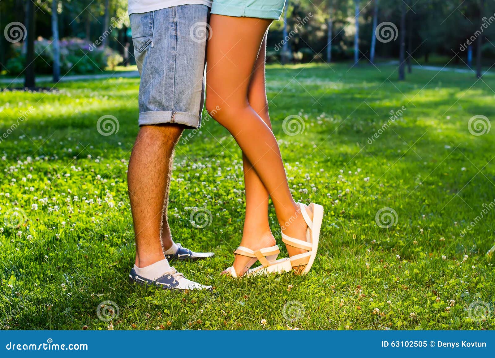 Happy Man Carrying His Girlfriend On Sunset Background 