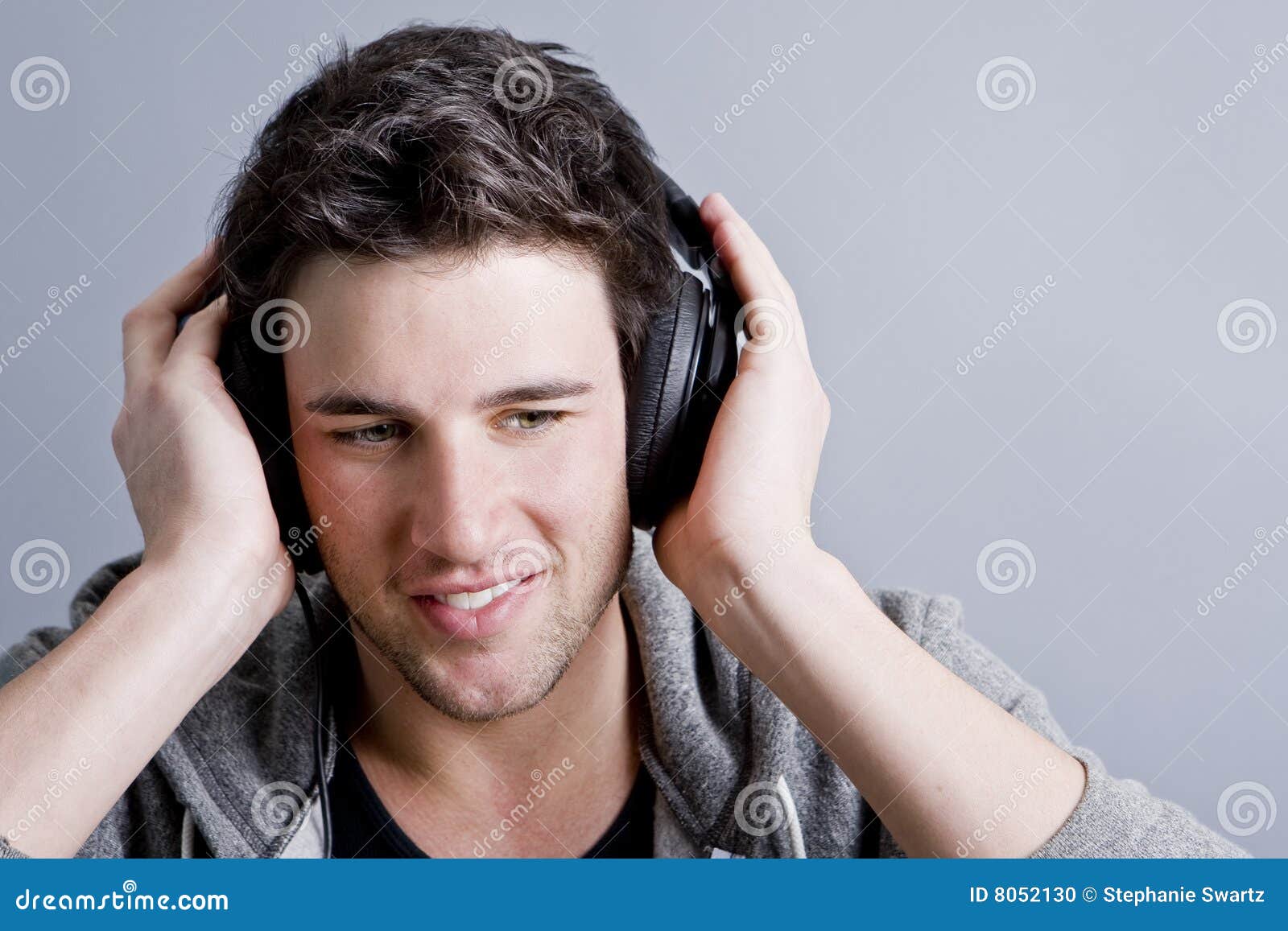 Guy holding headphones stock photo. Image of amazing, 8052130