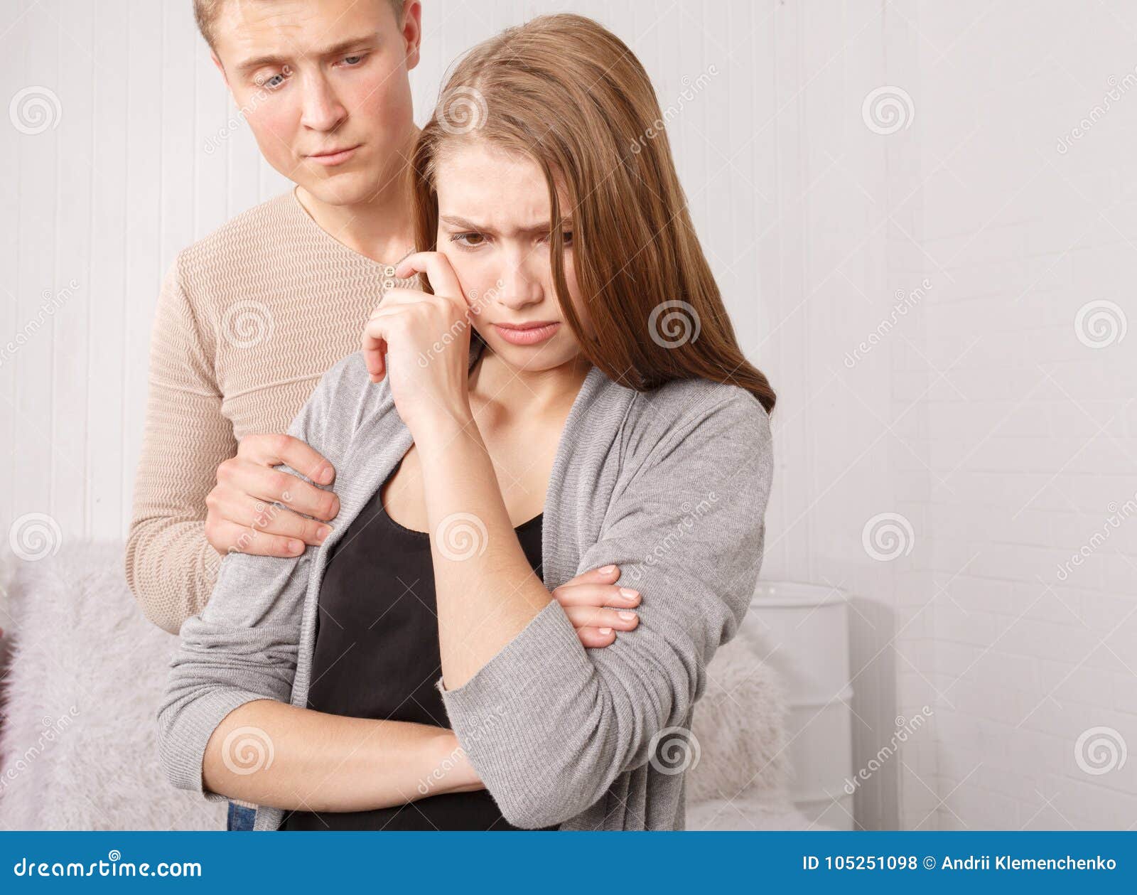 A Guy Holding an Injured Girl by the Shoulder Stock Photo - Image of ...