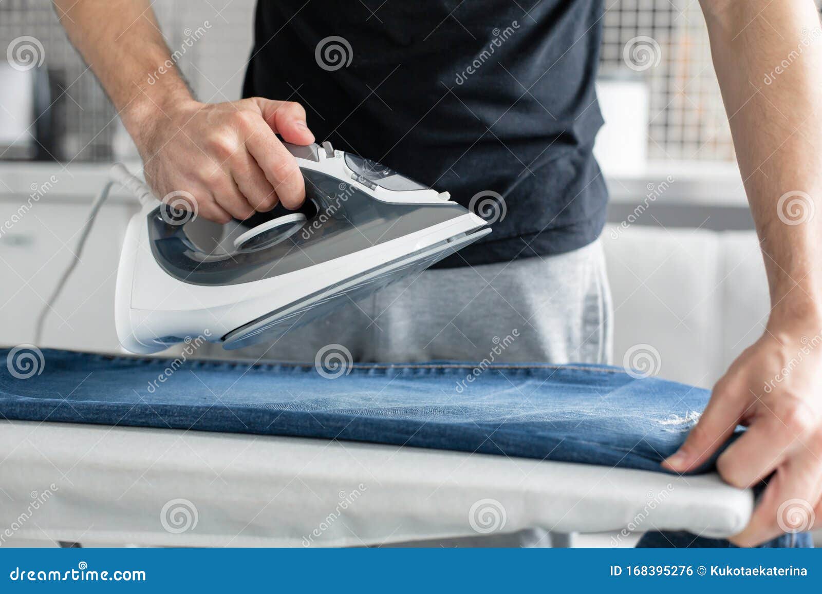 A Guy Ironing Clothes before Going Outside Stock Photo Image of cloth