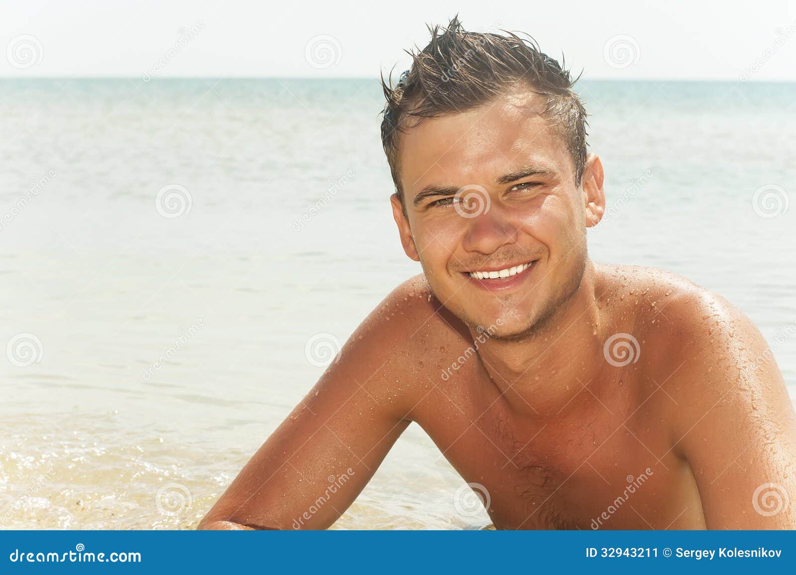 Guy lying in the water stock image. Image of beach, leather - 32943211