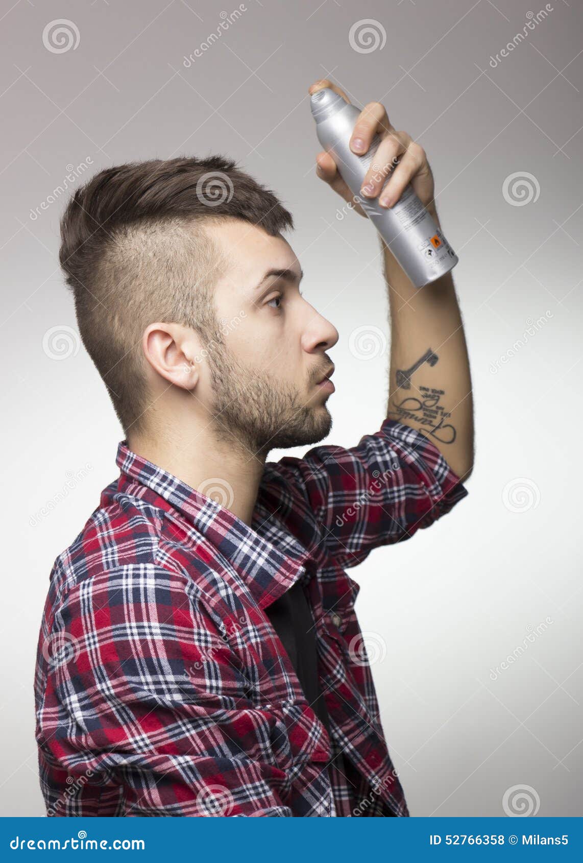 Guy With Mohawk Putting Hairspray. Stock Photo Image of white, male