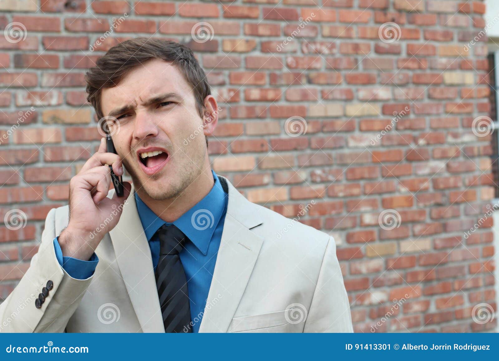 Guy On The Phone With Headache Upset Unhappy Male Talking
