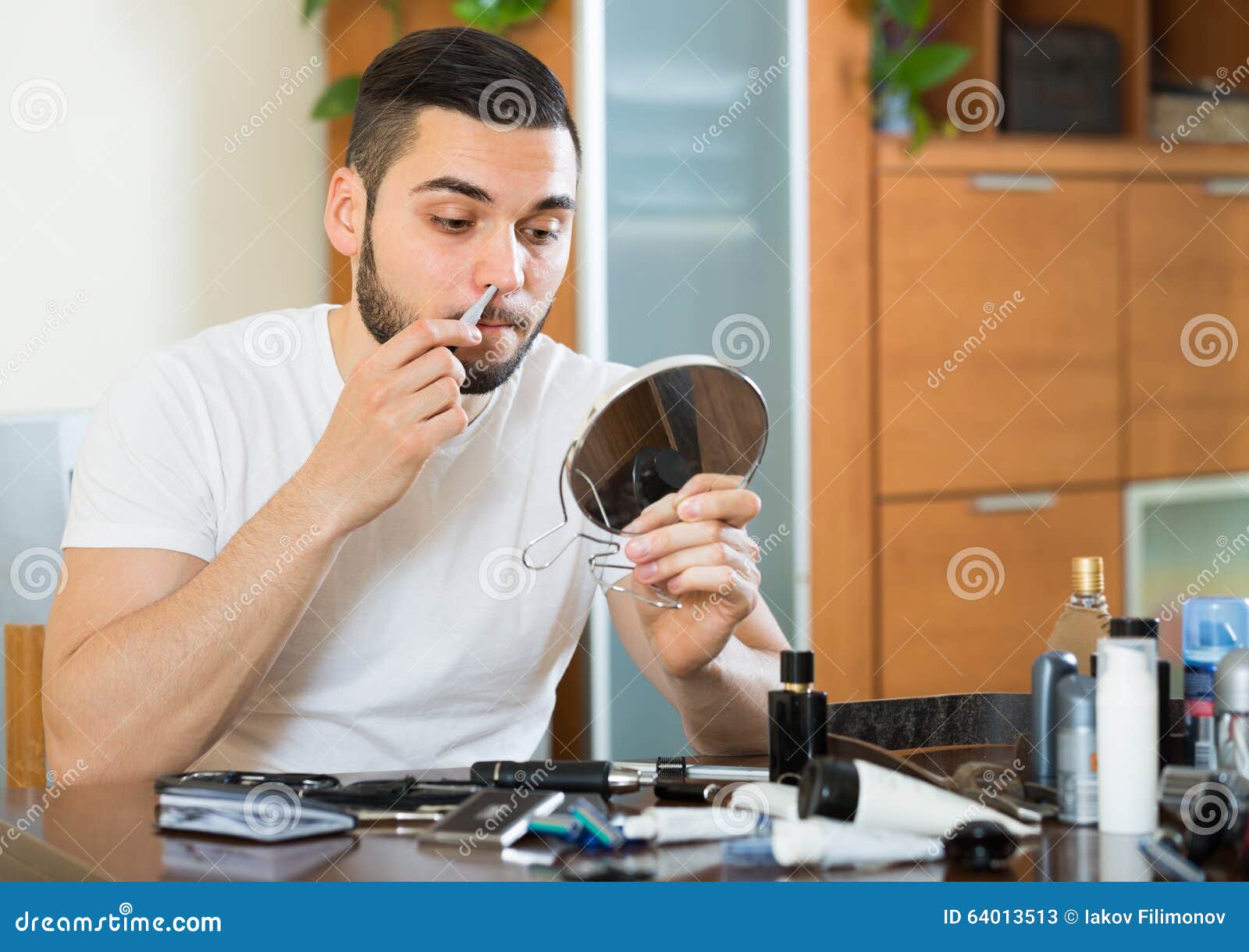 Guy Remove Hair from His Nose Stock Image Image of electronics