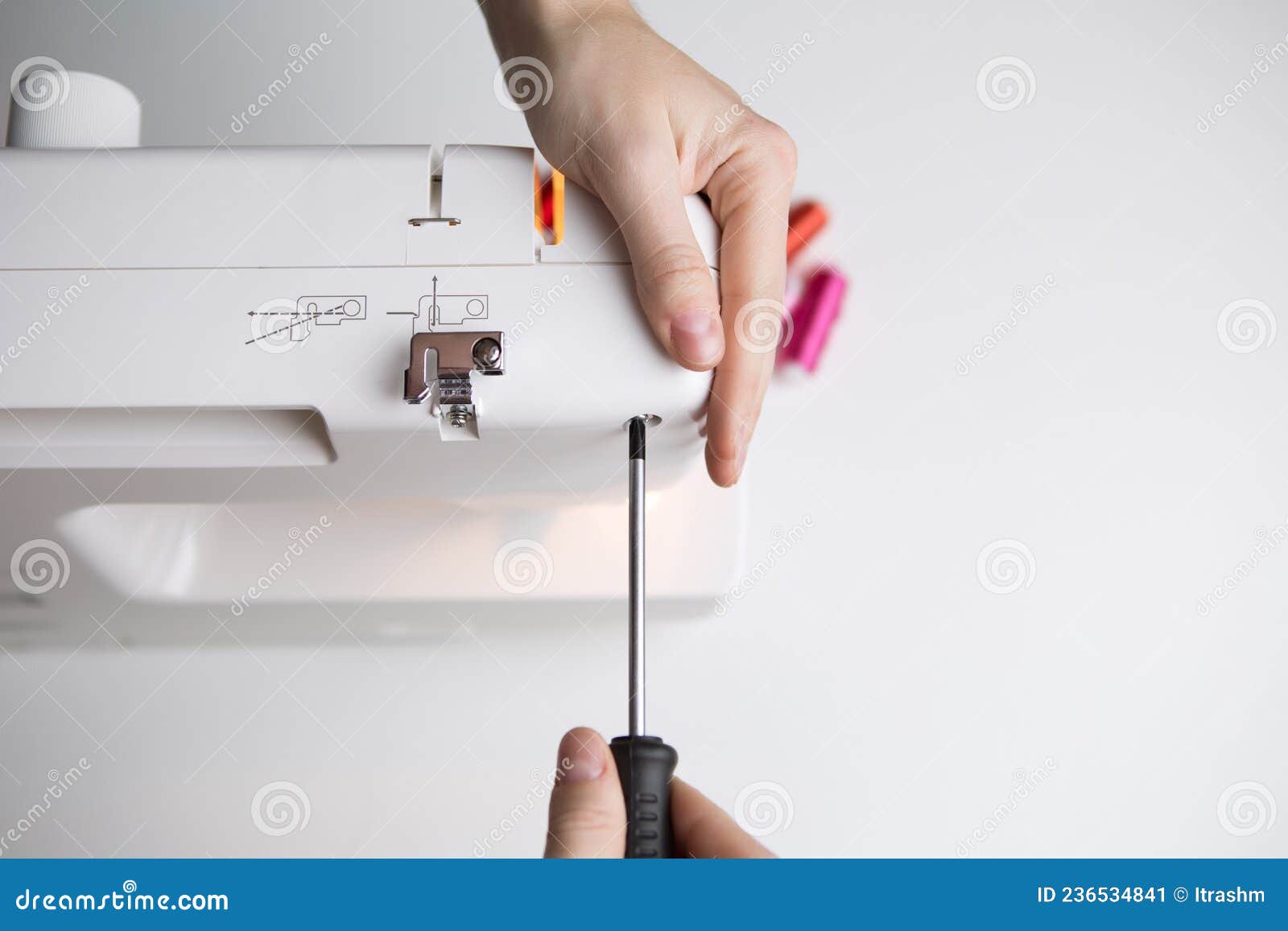 Guy with Screwdriver Repairing Sewingmachine Stock Image Image of