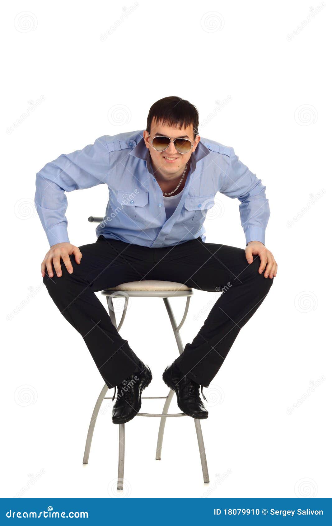 Guy sitting on the chair stock photo. Image of looking 18079910