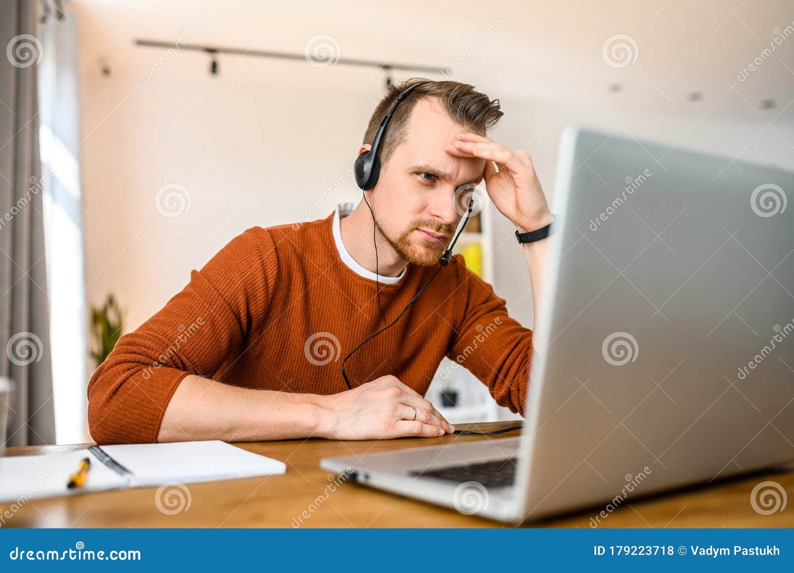 https://thumbs.dreamstime.com/z/guy-uses-hands-free-headsets-to-work-home-call-center-operator-support-service-office-headset-talk-sits-cup-179223718.jpg