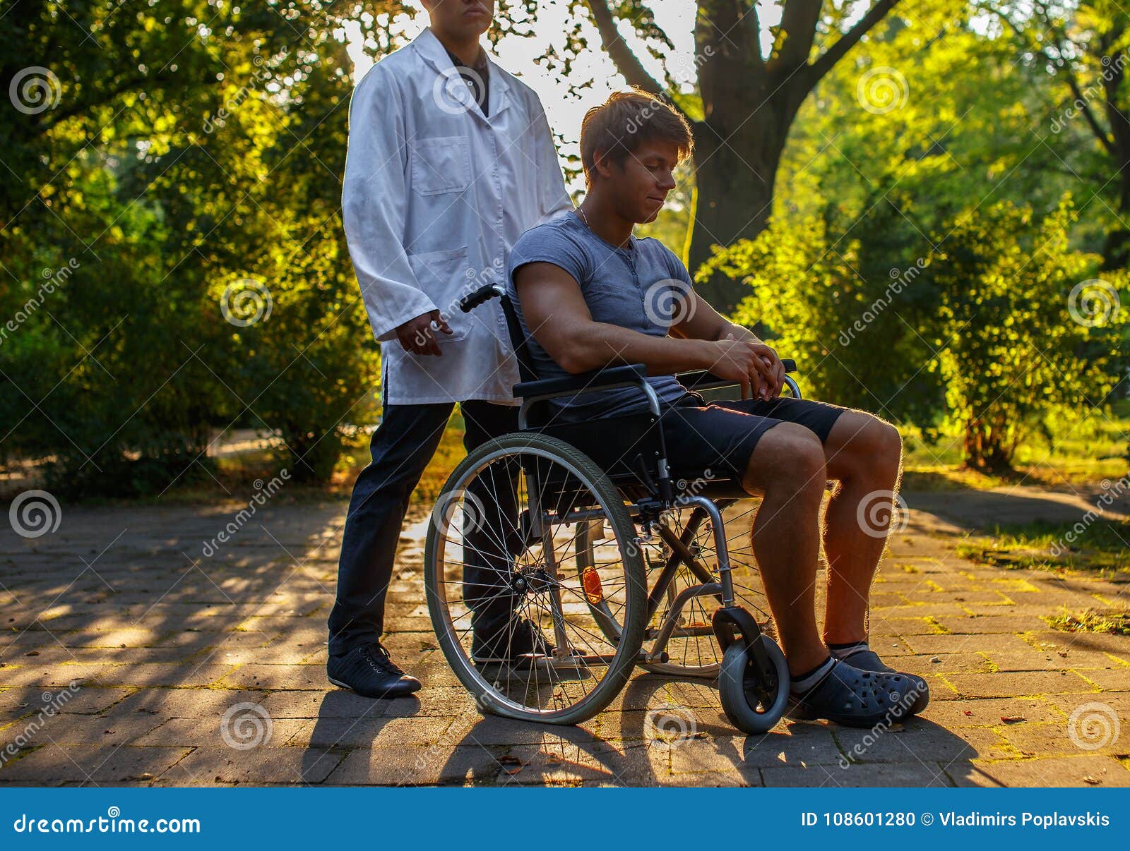 Guy in Wheelchair Resting in the Park. Stock Photo Image of invalid