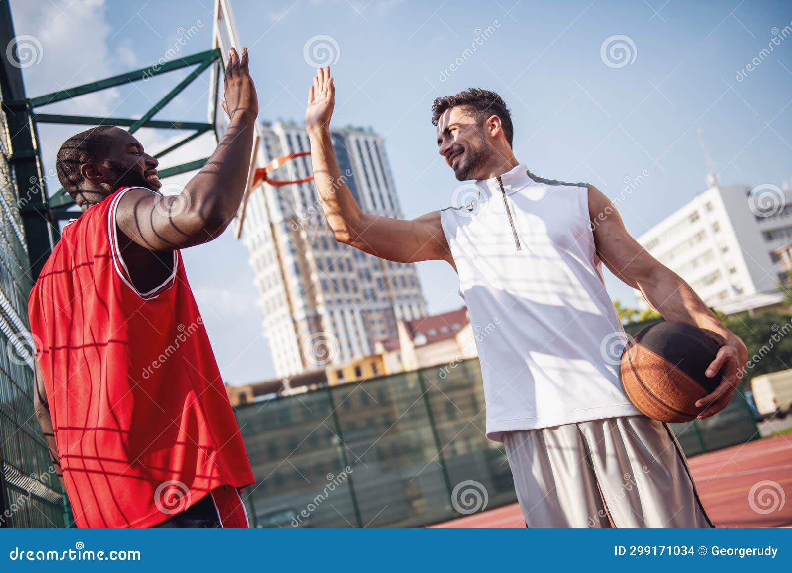 Guys playing basketball stock photo. Image of leisure - 299171034