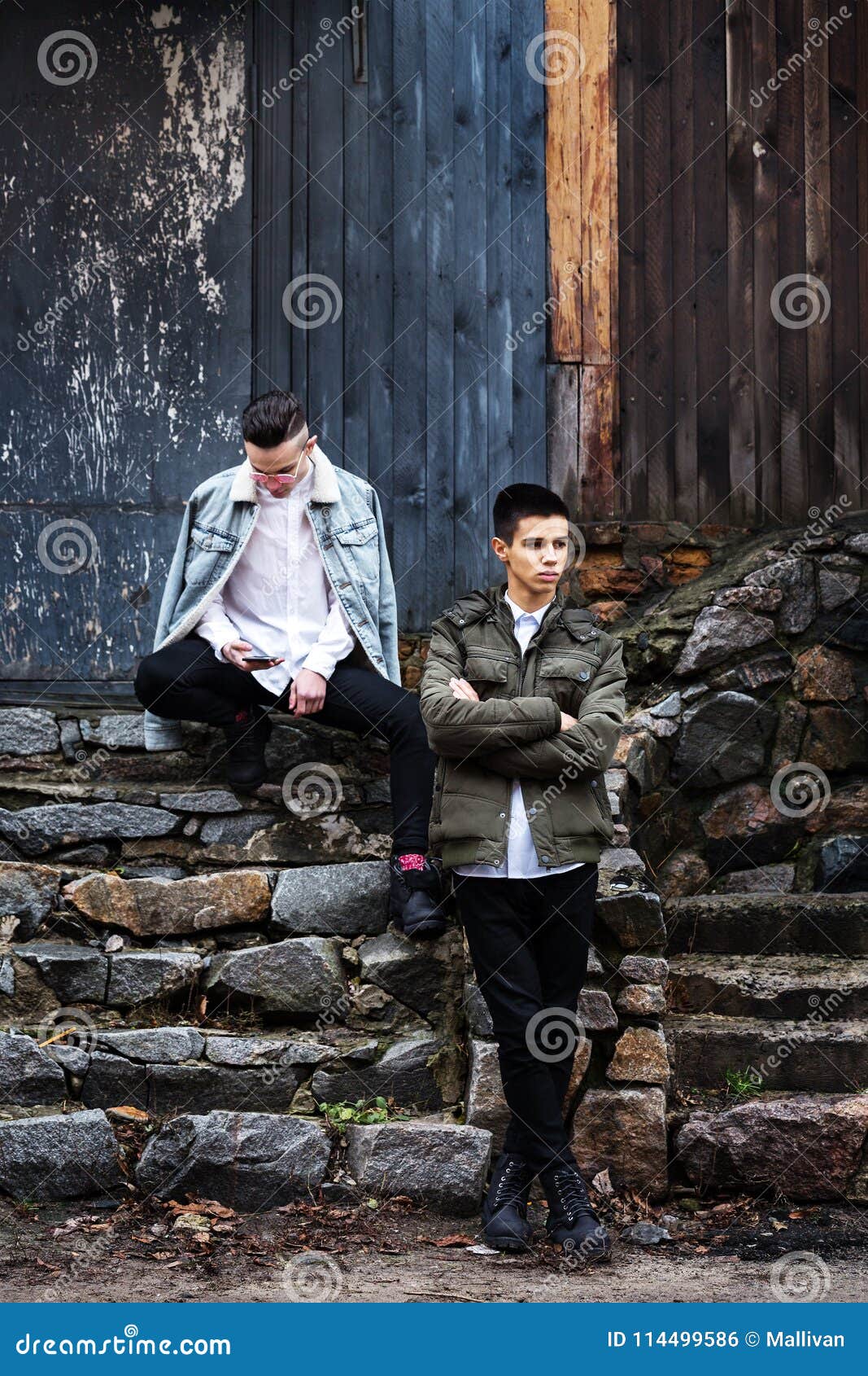 Guys on stone steps stock photo. Image of group, resentment - 114499586