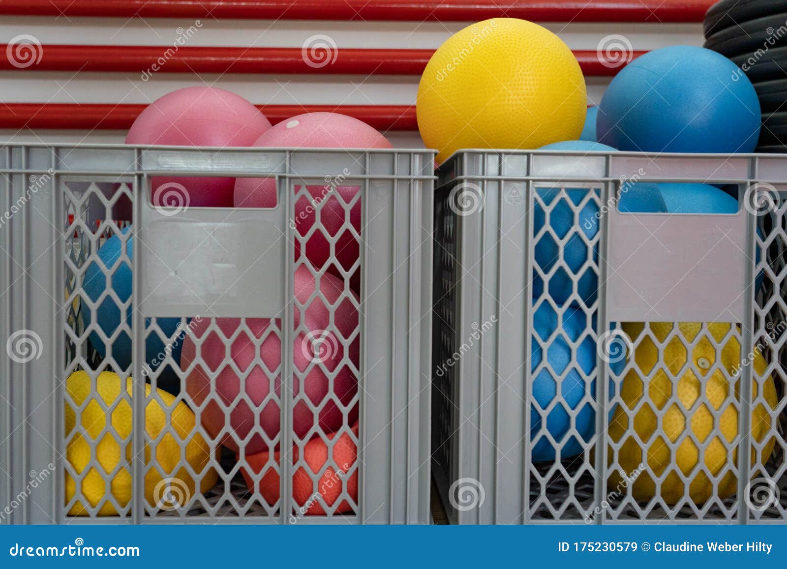 Gymnastic, Pilates and Yoga Balls in a Grey Basket in a Fitness Center ...