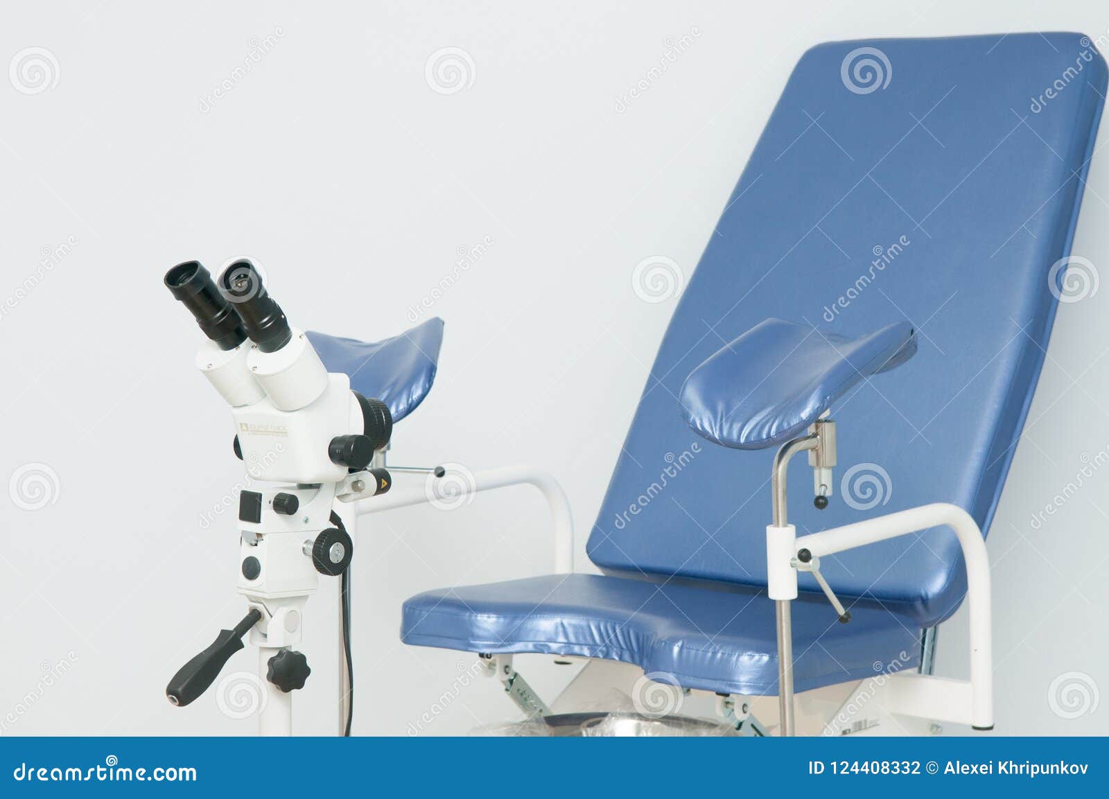 gynecological chair and colposcope in clinic