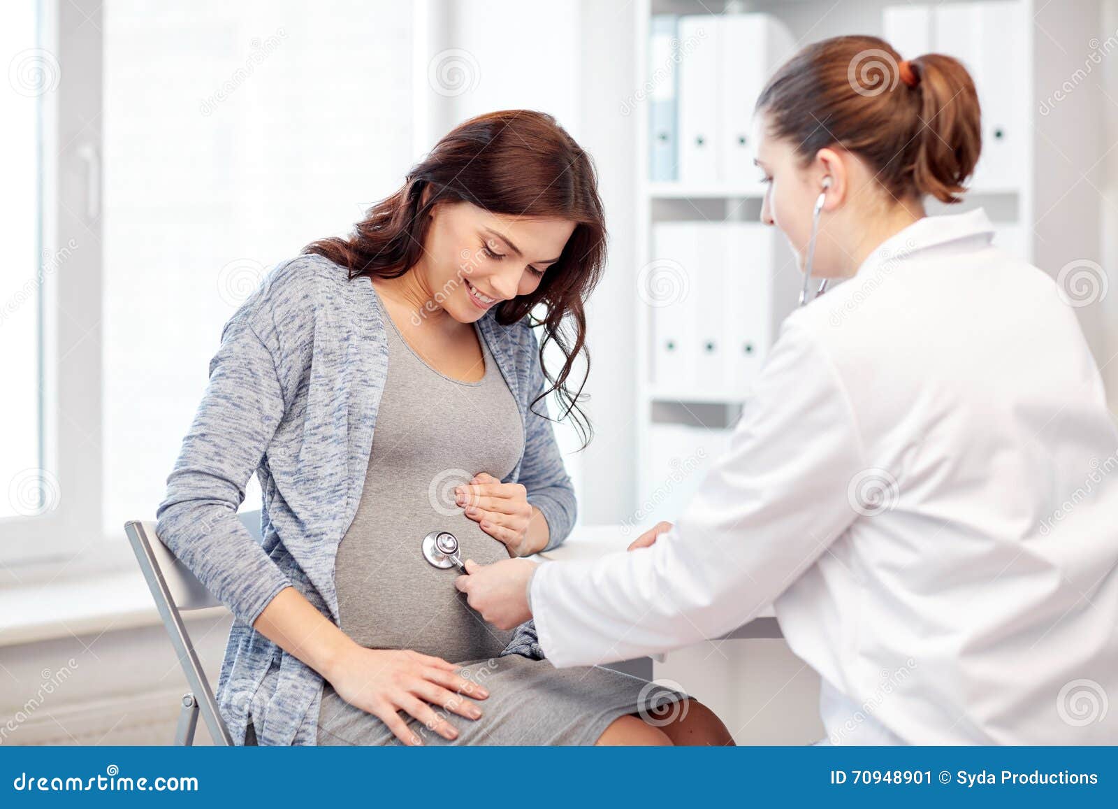 gynecologist doctor and pregnant woman at hospital