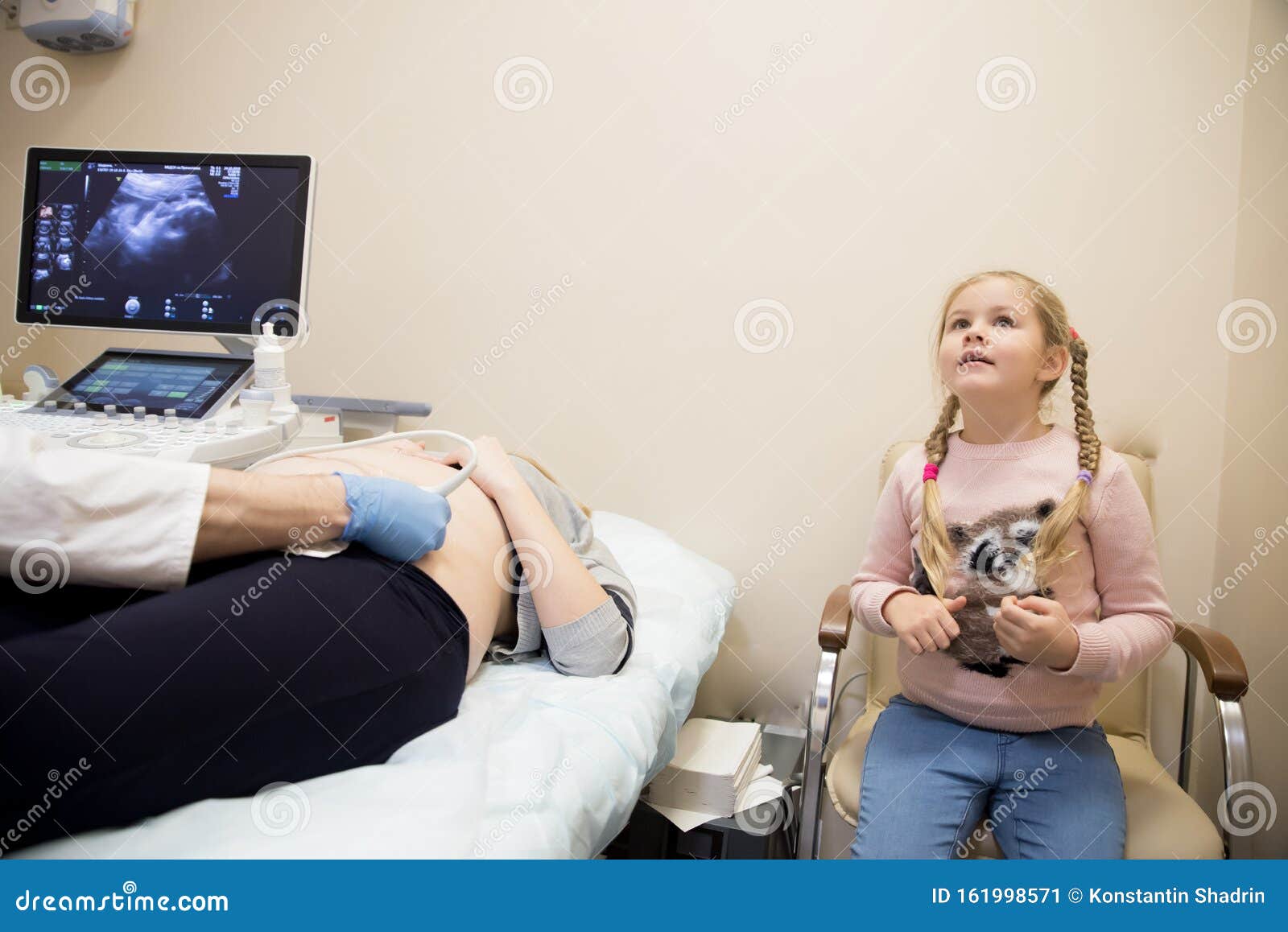 Gynecologist Does Cardiotocography Of The Fetus A Young Doctor 