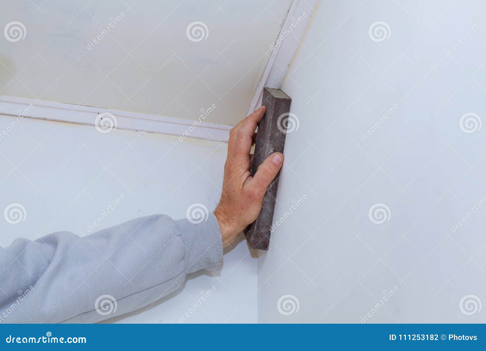 Gypsum Panel in the Form of on the Wall. Master Plasterer Smooths the