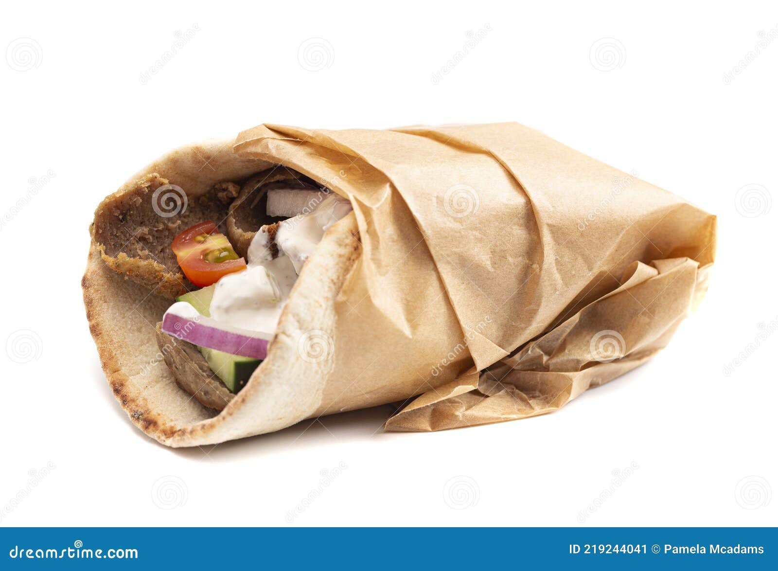 A Gyro with Vegetables and Garlic White Sauce on a White Background