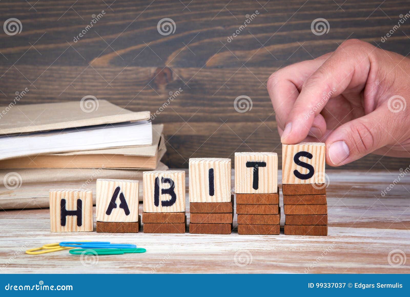 habits concept. wooden letters on the office desk, informative and communication background