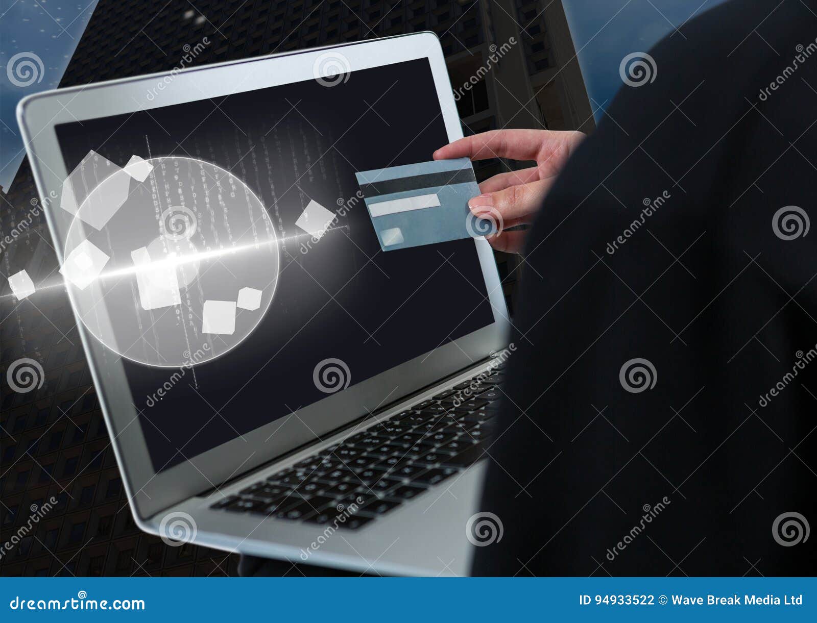 Hacker Holding A Credit Card And A Laptop In Front Of ...
