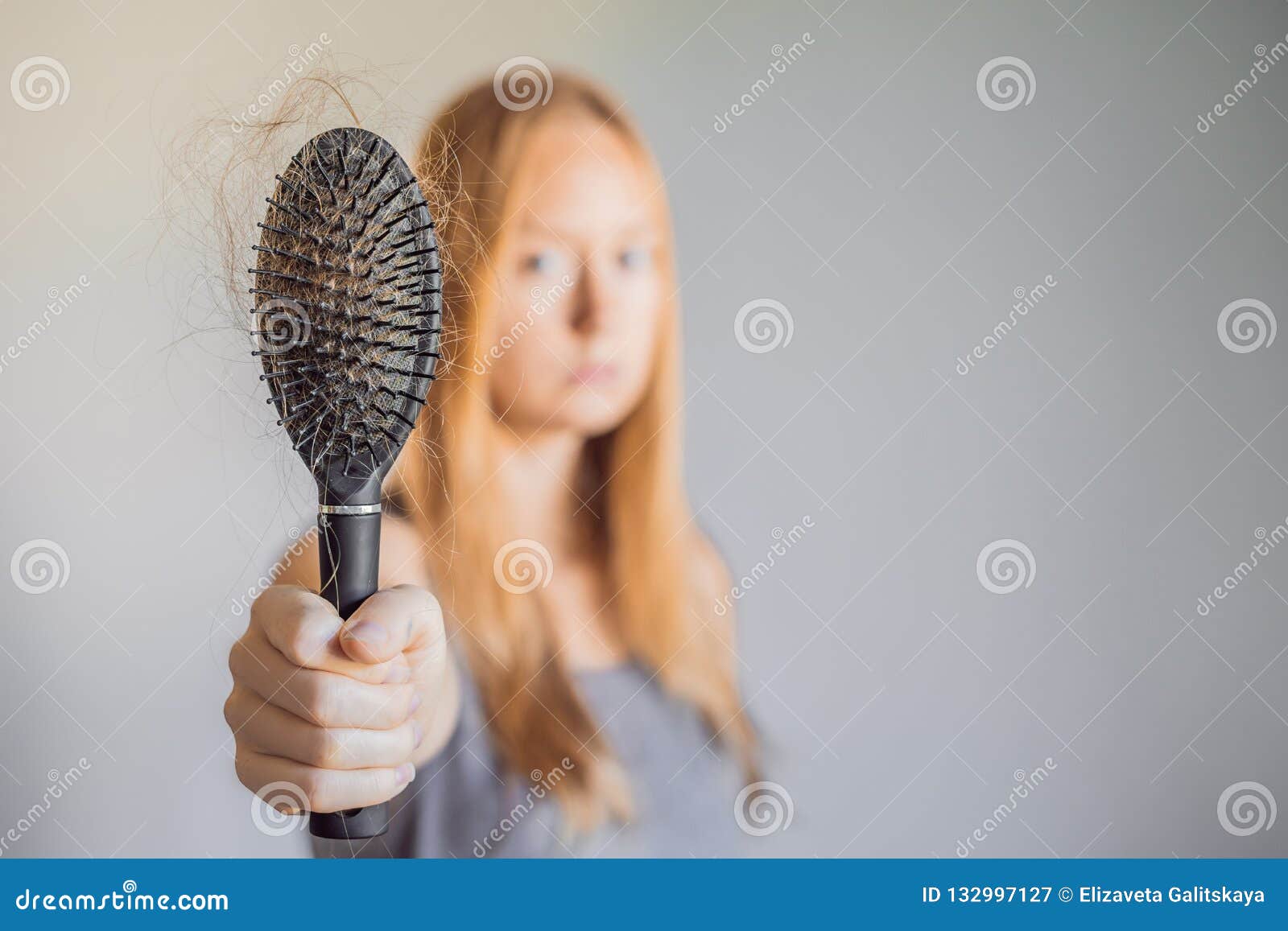 hair loss in women concept. a lot of lost hair on the comb