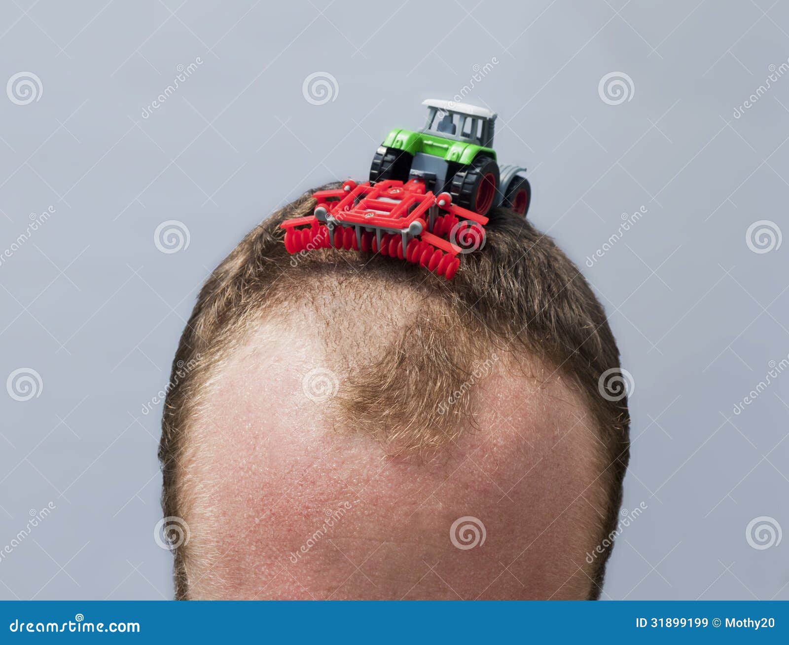 hair-plowing-toy-tractor-plows-balding-s